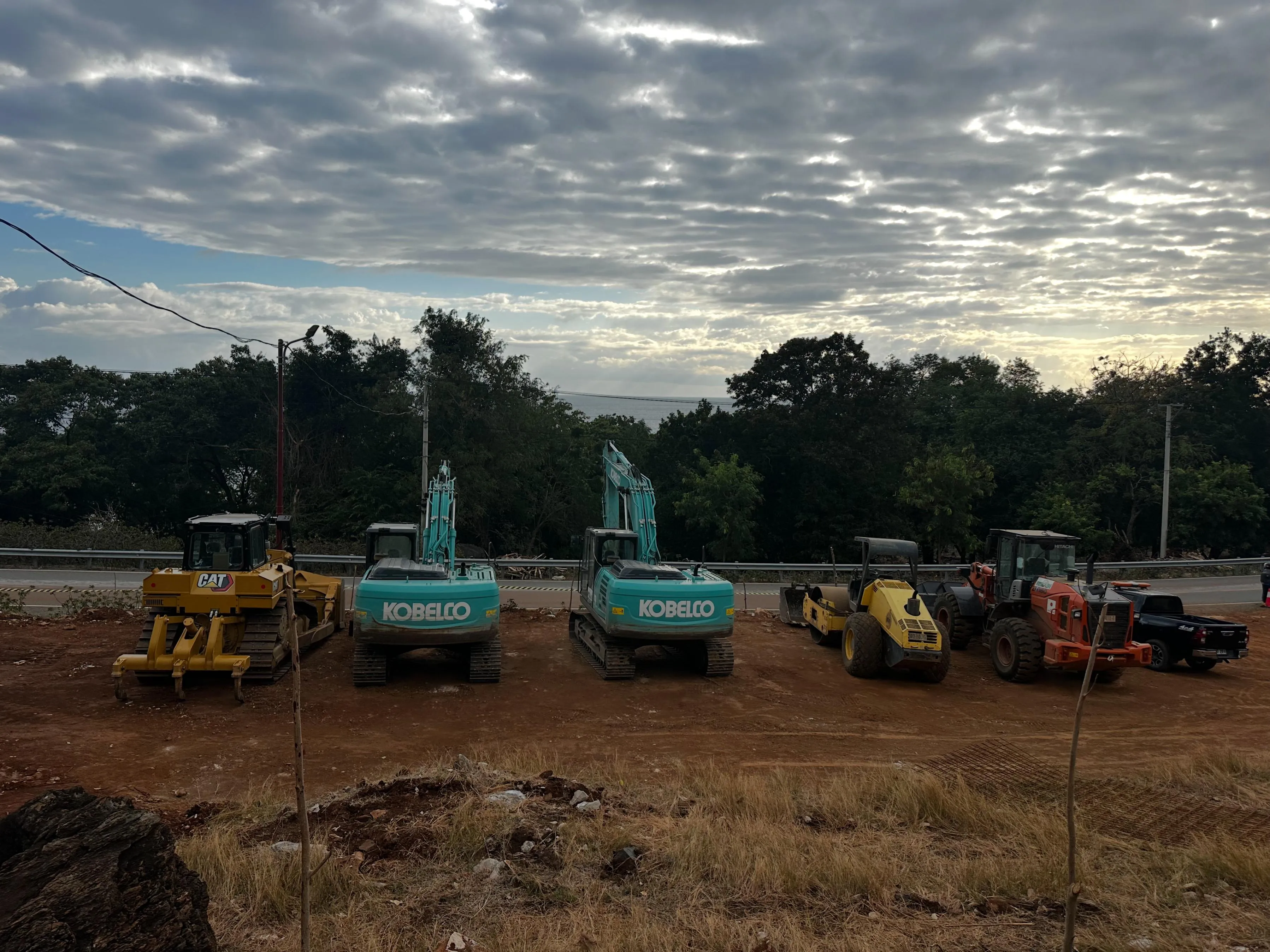 Construction machinery assembled for the Ilimanu White Marble Project access-road works